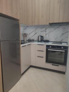 Kuchyň nebo kuchyňský kout v ubytování BP Beach Apartments