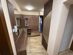 a bathroom with a sink and a mirror at Two-Bedroom Apartment in the Heart of Burgas, Bogoridi Street in Burgas City