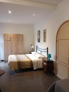 A bed or beds in a room at B&B Villa Lidia