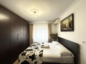 Ένα ή περισσότερα κρεβάτια σε δωμάτιο στο GH Apartment Tirana