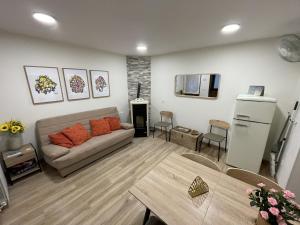 a living room with a couch and a table at Casa Rural Renueva en Buendía in Buendía
