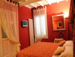 Postel nebo postele na pokoji v ubytování B&B A Casa Dell'Antiquario