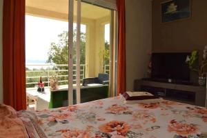 Postel nebo postele na pokoji v ubytování Villa avec vues exceptionnelles à 2 minutes de la plage