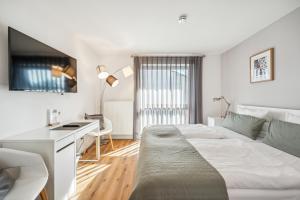 Postel nebo postele na pokoji v ubytování Gästehaus Hartwig