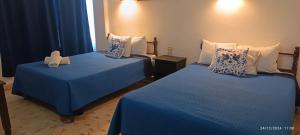 Cama ou camas em um quarto em Hotel Coral