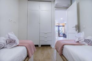 Ένα ή περισσότερα κρεβάτια σε δωμάτιο στο M&M SUITE LOS CACTUS by HOMESTAYGRANCANARIA +23 φωτογραφίες