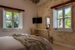 Ένα ή περισσότερα κρεβάτια σε δωμάτιο στο Villa SensiTerra