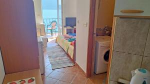 a laundry room with a view of the ocean at Rooms Beba in Herceg-Novi +16 photos