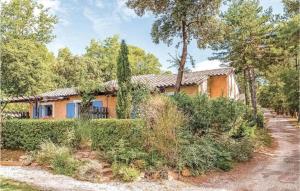 an orange house with trees and bushes at 40 - Mazet de Provence dans village de vacances in Gaujac
