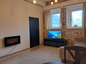 TV a/nebo společenská místnost v ubytování Crystal apartment