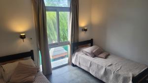 Ένα ή περισσότερα κρεβάτια σε δωμάτιο στο Sierra Duplex