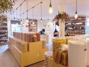 a store with lots of bags of food on display at Angela`s Loft in Ribeira Brava