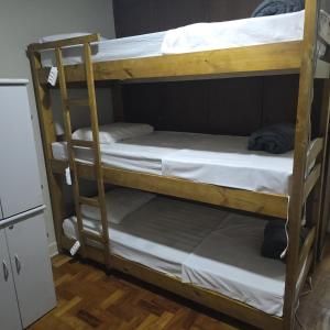 a couple of bunk beds in a room at Le house hostel in São Paulo