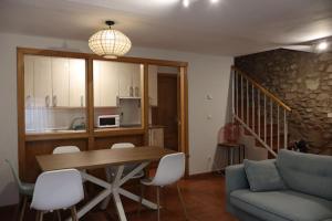 a living room with a table and a couch at Casa Don Jaime in Magaña