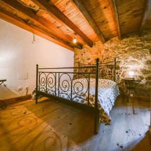 Postel nebo postele na pokoji v ubytování Refugio dos Cartolas