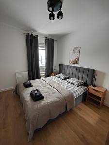 Ένα ή περισσότερα κρεβάτια σε δωμάτιο στο Apartament Jan