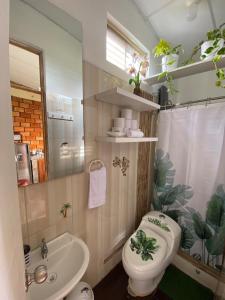 a bathroom with a toilet and a sink and a shower at Moyobamba Hosting House in Moyobamba +48 photos