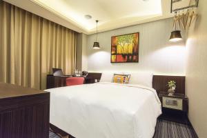 Voodi või voodid majutusasutuse V-one Hotel - Ningxia No. 2 Inn toas