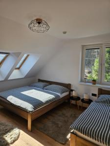 Postel nebo postele na pokoji v ubytování Horský apartmán MIKI