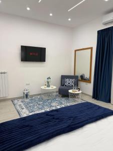 Televisyen dan/atau pusat hiburan di Le Pupatelle Apartment