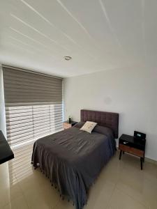 a bedroom with a large bed and a window at Casa Residencial la Primavera in Puerto Vallarta +24 photos