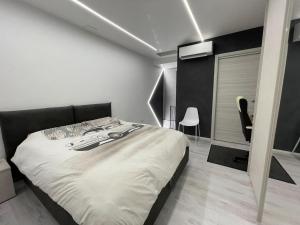 a bedroom with a large bed in a room at La Violetta Montemerlo in Villa Marin +9 photos