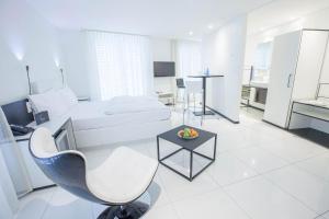 Televiisor ja/või meelelahutuskeskus majutusasutuses Boutiquehotel Thessoni Classic & Self service Residence Home Zürich