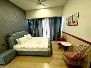 En eller flere senge i et værelse på The KLCC At Star SKY Pools + 58 billeder