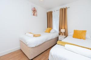 Postel nebo postele na pokoji v ubytování Elena Apartment