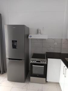 Kuchyň nebo kuchyňský kout v ubytování Kalymnos Platy Gialos Mousellis Makis Apartments