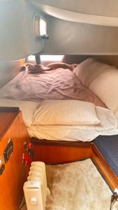 a bedroom with a large bed with a person laying on it at Slowlife in Lisbon +13 photos