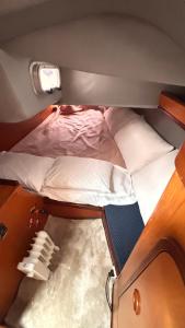 a small room with two beds and a window at Slowlife in Lisbon