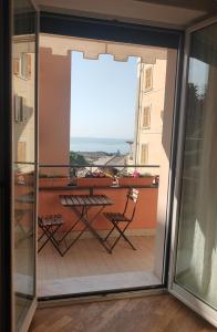 a view from a balcony with a table and chairs at Il Balcone di Anna - Nervi - 65mq Bilocale in Genoa +10 photos