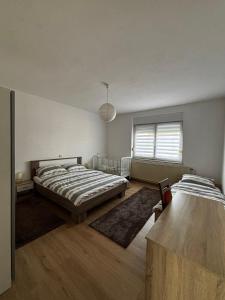 Postel nebo postele na pokoji v ubytování Apartman Kuća 150