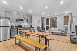 a kitchen and living room with a table and a couch at Live Like a Local in the Heart of Adams Morgan in Washington, D.C.