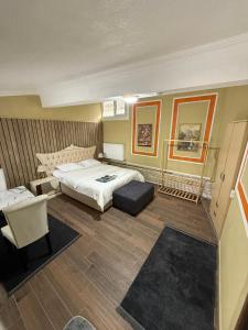 a bedroom with a bed and a chair and a table at De La Terrasse IZNIK in İznik +38 photos
