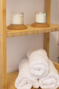 a pile of towels sitting on a shelf at Aviothic Home in Naples +31 photos
