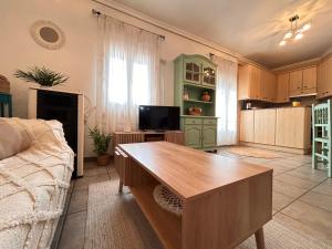 a living room with a couch and a table at Apartamento La Plaza! in Bogarra +22 photos