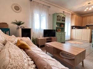 a living room with a couch and a tv at Apartamento La Plaza! in Bogarra