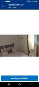 a picture of a bedroom with a bed in a room at Hospedaria meu Lar in Rio das Ostras +2 photos