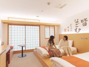 Кровать или кровати в номере Hotel Tenpyo Naramachi - Vacation STAY 59515v