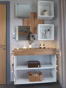 a shelf with christmas lights on it in a room at Maritonia's comfort apartment in Loutraki