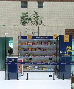 a store display with food on shelves in a store at FLAT próximo ao mar in Cabedelo