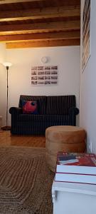 a living room with a couch and a table at A Casinha do Arco, Porta da Vila in Nisa