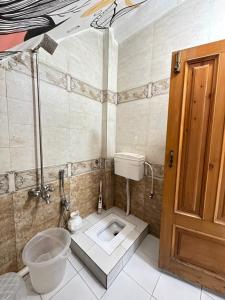 a bathroom with a toilet and a sink in it at Luxury Home in Peshawar Gulbahar in Peshawar +9 photos