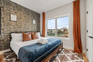 a bedroom with a bed with a teddy bear on it at 2br 3ba 2King bd 3 Car Parking Bonus area with Queen Bed in East Newark