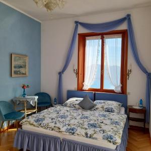 Postel nebo postele na pokoji v ubytování Villa Morissolina
