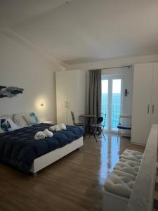 Posteľ alebo postele v izbe v ubytovaní Marina House