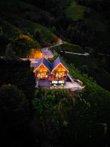 an aerial view of a house in a vineyard at night at 101 nolu oda in Çamlıhemşin +9 photos