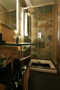 a bathroom with a shower and a sink at OLGA Luxury Suite I 5 min from airport I central location I traditional village in Luqa
